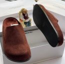 Common Projects men's burgundy suede slip-on mule slides with a black rubber sole, displayed in a white branded shoebox.