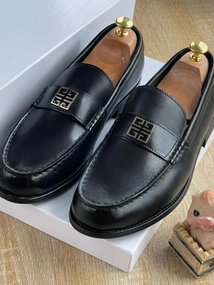 A pair of rich burgundy Givenchy 4G Buckle loafers
