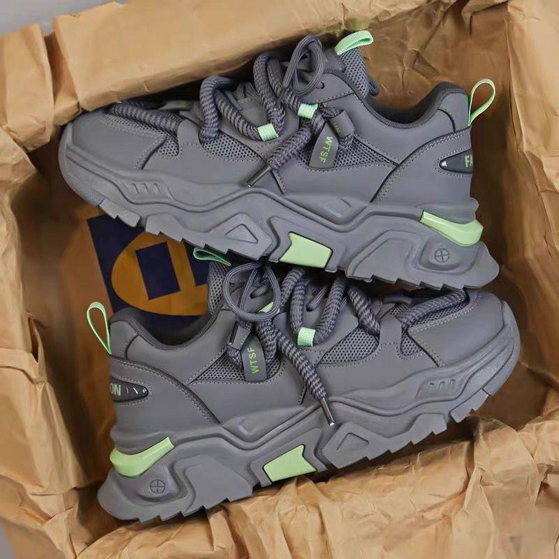 WTSF Men’s Luxury Chunky Sneakers A pair of men's luxury grey chunky sneakers with lime green accents, displayed in a box with brown paper, showcasing their bold design and thick, cushioned sole.