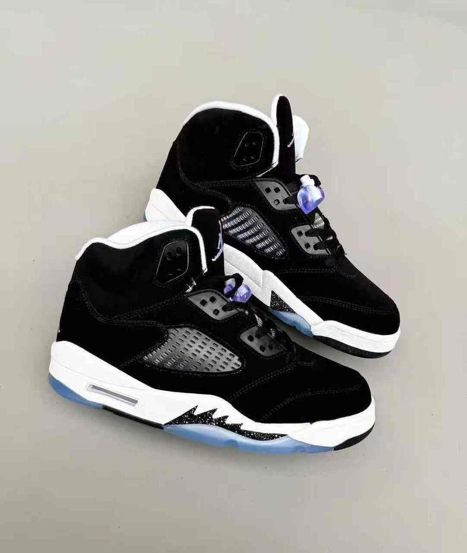 Nike Air Jordan 5 – Premium Leather & Suede High-Top Sneaker Nike Air Jordan 5 “Black Grape” high-top sneaker in black suede and leather with translucent blue outsole and purple lace lock