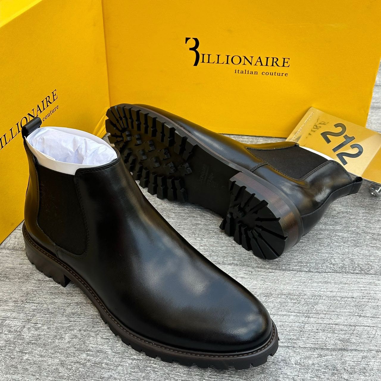 Black men's leather 3illionaire Chelsea boots with elastic side panels and rugged rubber lug sole.