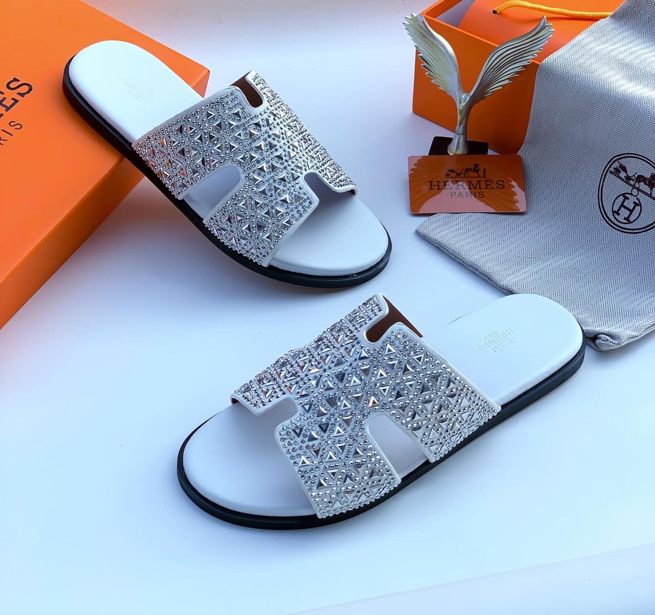 Hermès Oran Sandal – Crystal-Embellished Hermès Oran Crystal Slide Sandal – White Leather with Sparkling ‘H’ Strap | Luxury Designer Slides for Nigerian Men | Authentic Hermès Paris Footwear