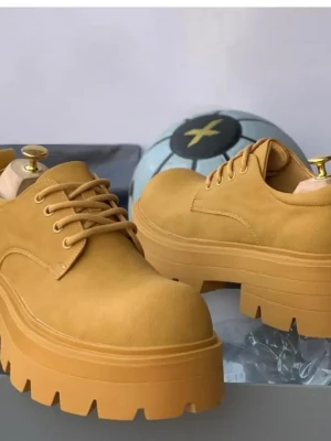 Bold mustard yellow Balenciaga Triple S platform oxfords
