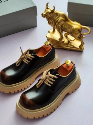 Balenciaga Triple S platform oxfords with a sleek patent leather upper