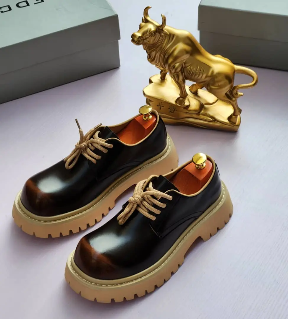 Balenciaga™ Triple S Platform Oxford Balenciaga Triple S platform oxfords with a sleek patent leather upper