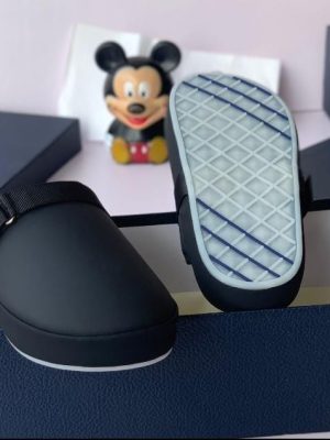 Prada men’s matte black neoprene slip-on slide with signature triangle logo and cushioned sole — luxury comfort slide for poolside, weekend flex, and high-end indoor-outdoor wear.