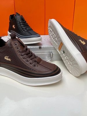 Brown leather Lacoste high-top sneakers with woven texture, gold crocodile logo, and white chunky platform sole - luxury men's streetwear shoes