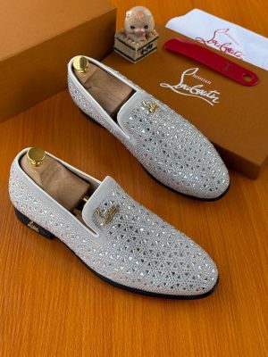 White silver crystal-embellished Christian Louboutin loafers with iconic red sole and gold hardware - luxury men's formal shoes with rhinestone upper