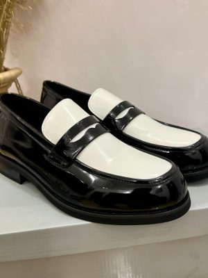 Black and white two-tone patent leather penny loafers with high-gloss finish - luxury men's formal shoes with contrasting color block design