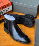 Brown leather Clarks Chelsea boots with side buckle detail and rubber tread sole - premium men's dress boots with pull tab