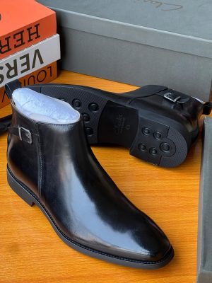 Brown leather Clarks Chelsea boots with side buckle detail and rubber tread sole - premium men's dress boots with pull tab