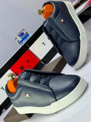 Navy blue leather Tommy Hilfiger sneakers with white platform sole and elastic criss-cross straps - luxury men's slip-on shoes with flag logo