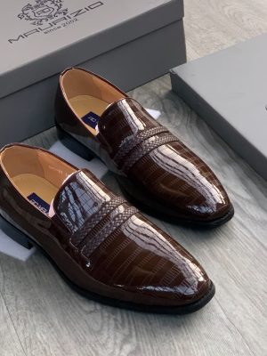 Men's burgundy genuine ostrich leather horsebit loafers with square toe, gold hardware, and rubber sole, displayed on grey wood floor with branded shoebox.
