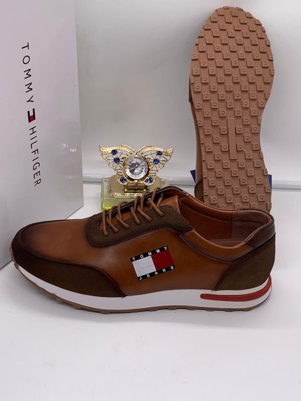 Tommy Jeans retro runners leather/suede sneakers Tommy Jeans men's white and olive leather retro runner sneakers with gum sole and embroidered flag logo, displayed with branded white shoebox and decorative perfume bottle.