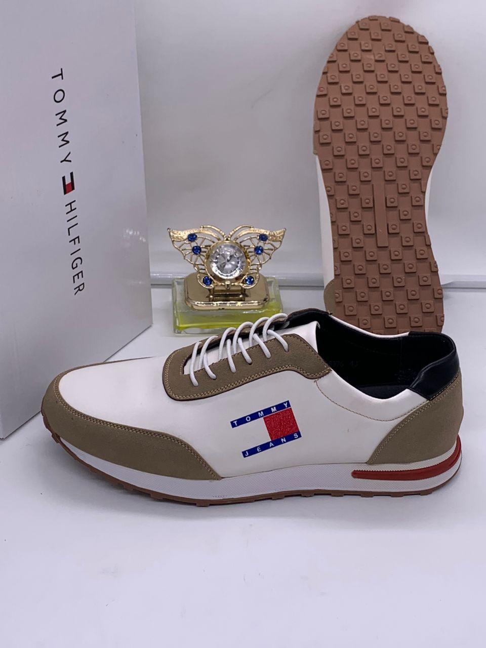 Tommy Jeans retro runners leather/suede sneakers Tommy Jeans men's white and olive leather retro runner sneakers with gum sole and embroidered flag logo, displayed with branded white shoebox and decorative perfume bottle.