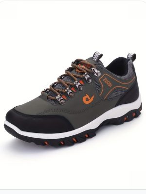 Zuodi men's olive green and orange outdoor hiking shoes with mesh panels, metal eyelets, and thick black rubber lug sole, displayed on white background.