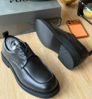 FDCP men's black leather derby shoes with tonal laces and thick black rubber sole, displayed on wooden surface with grey branded shoebox and orange phone.