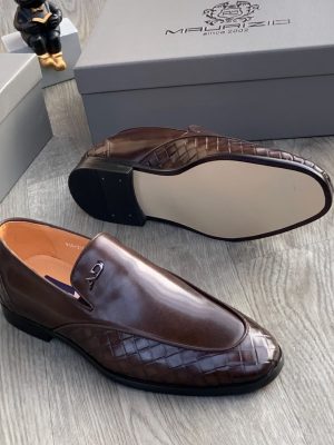 Men's chocolate brown Maurizidio woven leather loafers with metallic logo and black rubber sole, displayed on grey wood floor with branded shoebox.