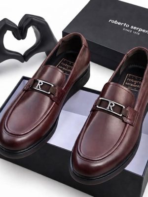Burgundy men's smooth leather loafers with silver R-buckle hardware and rubber sole by Roberto Serpentini.