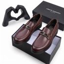 Burgundy men's smooth leather loafers with silver R-buckle hardware and rubber sole by Roberto Serpentini.