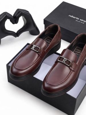 Burgundy men's smooth leather loafers with silver R-buckle hardware and rubber sole by Roberto Serpentini.