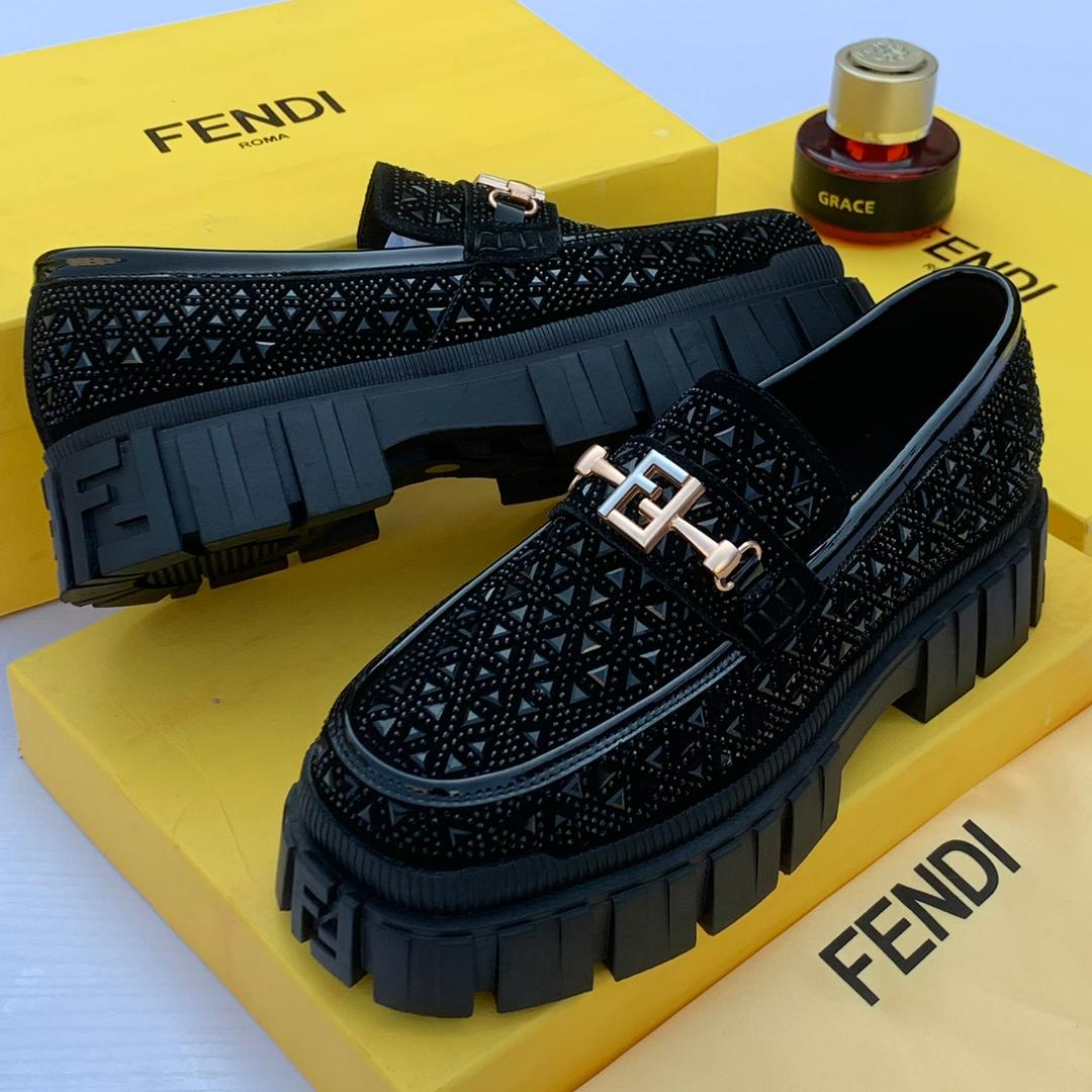 Premium Fendi black platform loafers Black men's Fendi platform loafers with geometric textured upper, metallic FF hardware, and chunky rubber lug sole.
