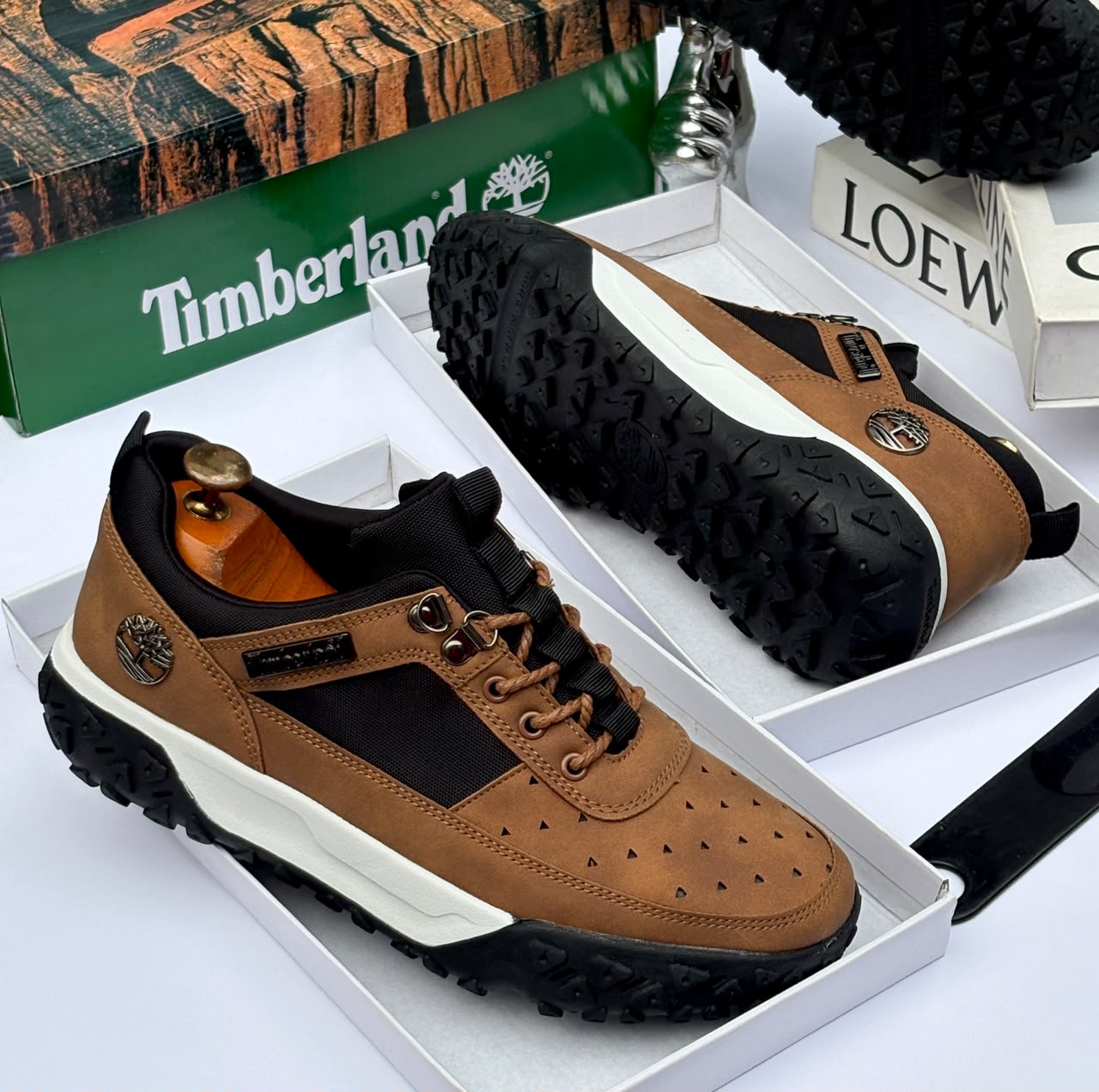 Premium brown Timberland suede and textile sneakers Men's luxury brown Timberland suede and black textile sneakers with white midsole and rugged black lug outsole sitting in an open shoebox.