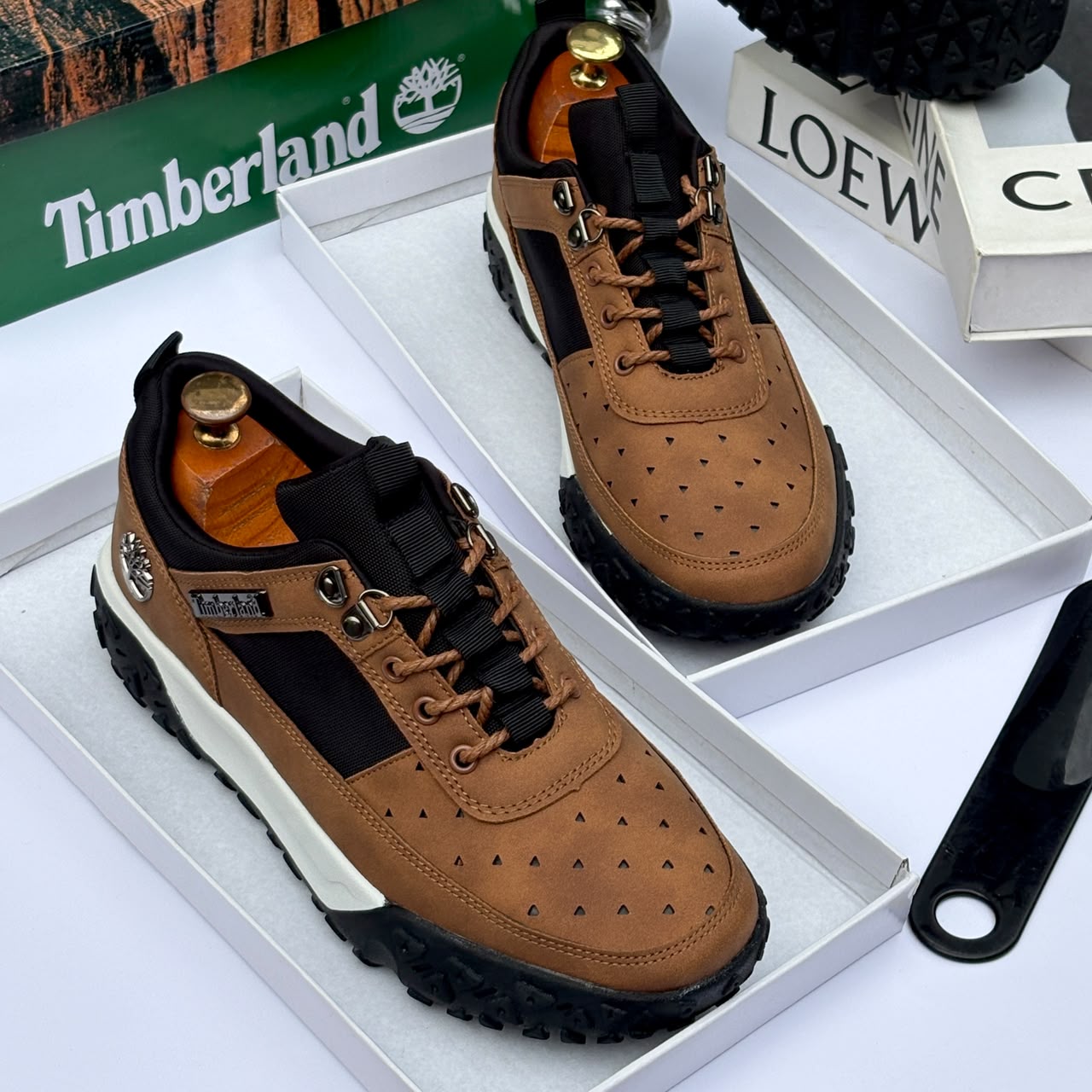 Premium brown Timberland suede and textile sneakers Men's luxury brown Timberland suede and black textile sneakers with white midsole and rugged black lug outsole sitting in an open shoebox.
