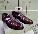 Richwanaz men's burgundy leather fisherman sandals with ribbed texture, adjustable buckle strap, and rubber sole, displayed on branded green shoeboxes.