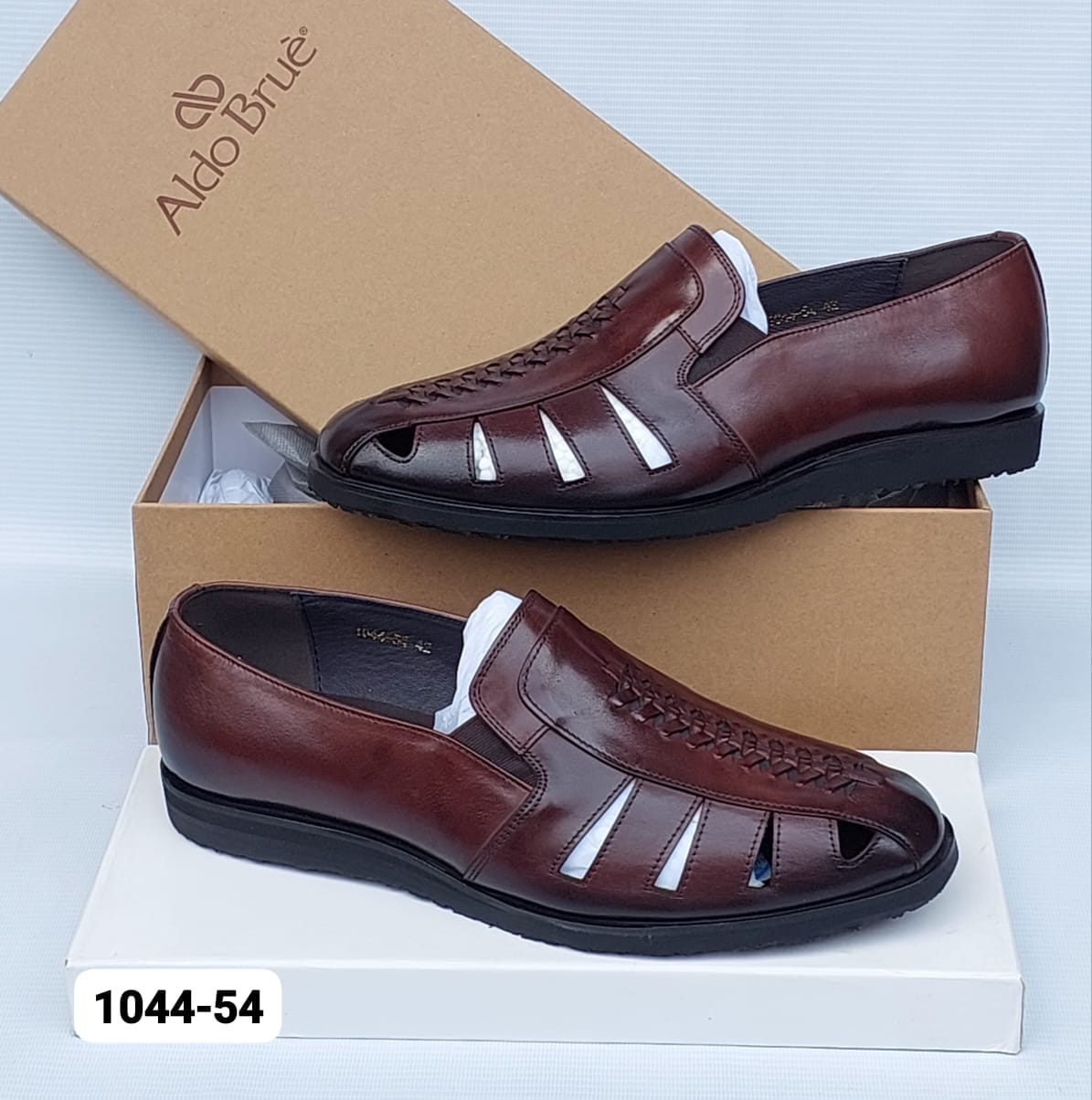 Aldo Bruè leather fisherman sandals Aldo Bruè men's burgundy leather fisherman sandals with woven vamp detailing and black rubber sole, displayed with branded brown shoebox on white surface.