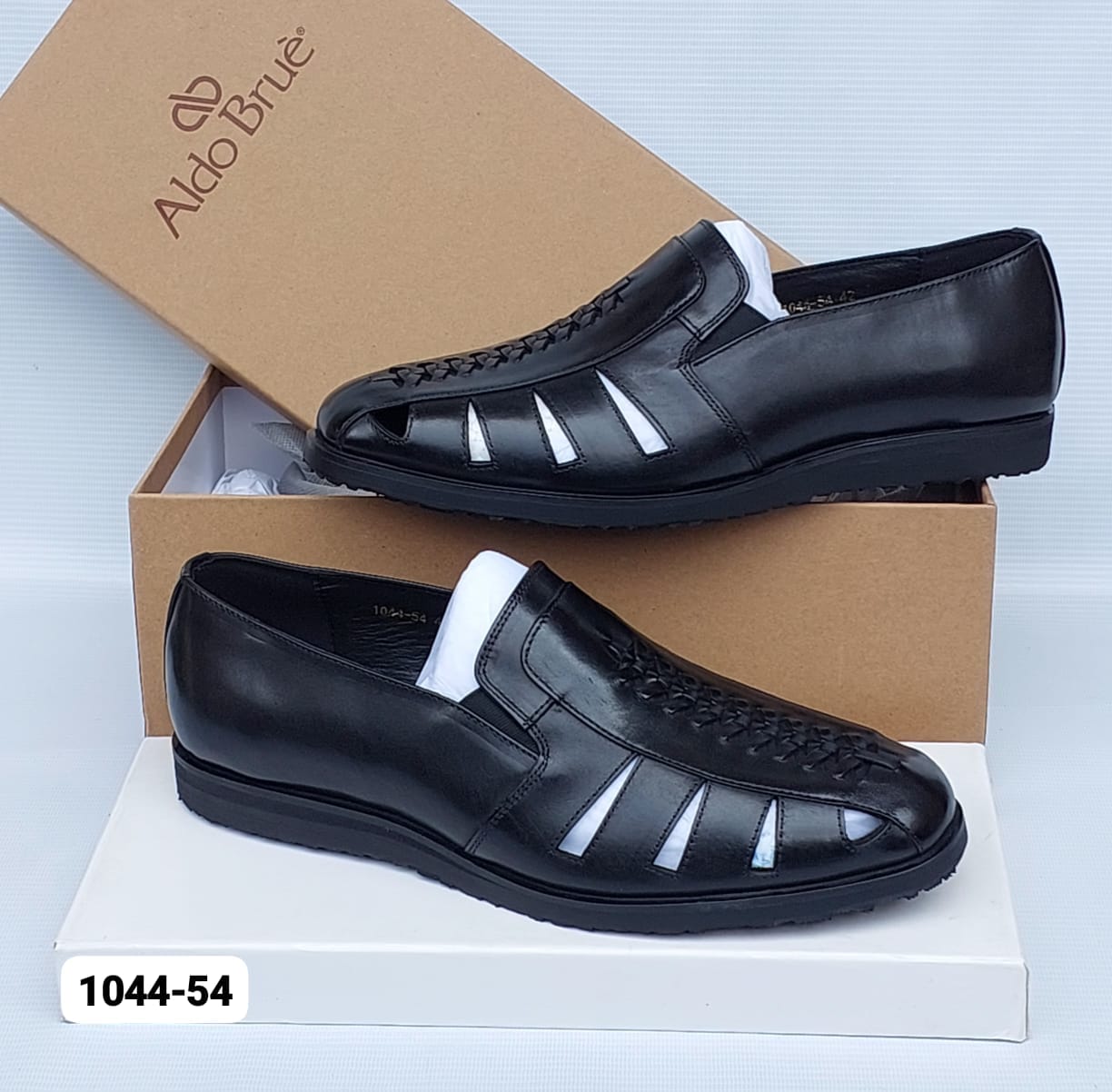 Aldo Bruè leather fisherman sandals Aldo Bruè men's burgundy leather fisherman sandals with woven vamp detailing and black rubber sole, displayed with branded brown shoebox on white surface.