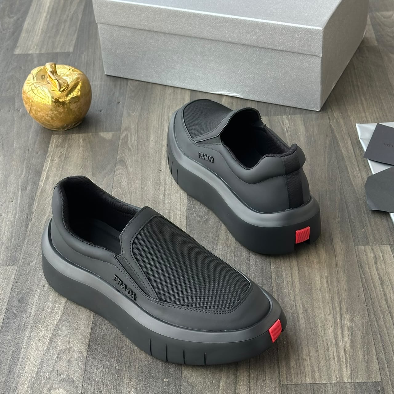 Prada white leather and mesh slip-on sneakers Prada men's leather and mesh