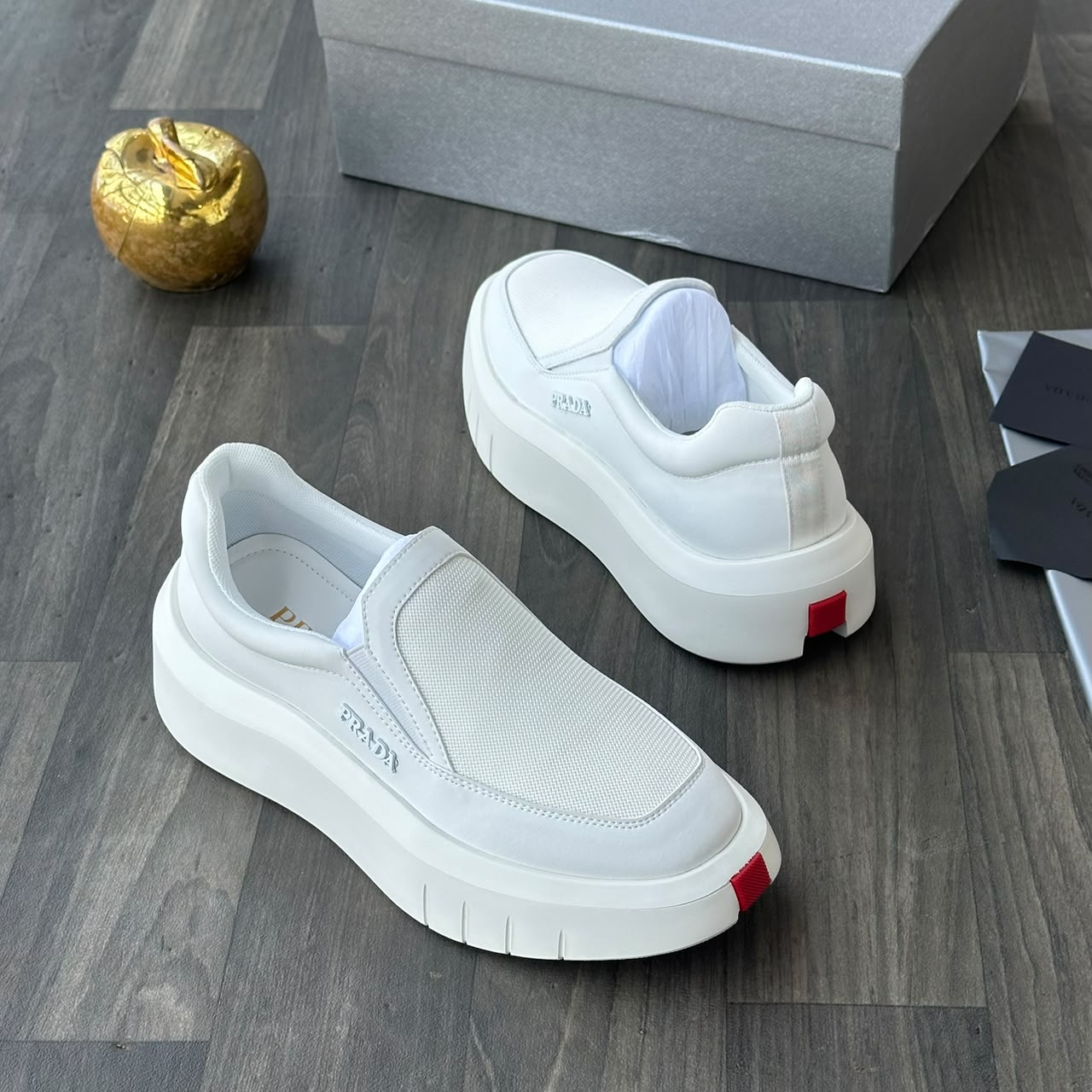 Prada white leather and mesh slip-on sneakers Prada men's white leather and mesh