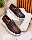 Dark brown men's textured leather penny loafers with white rubber platform sole and classic slip-on design.