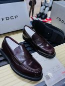 FDCP men's burgundy high-gloss leather loafers with embossed strap detail and thick black rubber sole, displayed with branded grey shoebox and sales receipt.