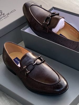 Men's dark chocolate Malraizio braided leather loafers with perforated detailing, gunmetal hardware, and rubber sole, displayed in grey branded shoebox on wood floor.