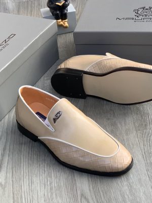 Men's beige Maurizidio woven leather loafers with white piping, metallic logo, and black rubber sole, displayed on grey wood floor with branded shoebox.