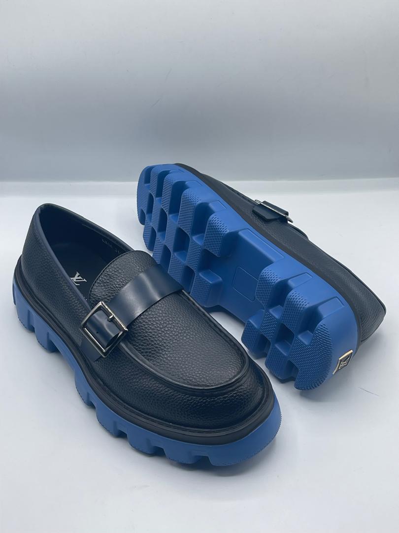 Premium Louis Vuitton chunky-sole loafers Men's dark pebbled leather Louis Vuitton loafers with a chunky royal blue rubber sole and silver buckle strap.