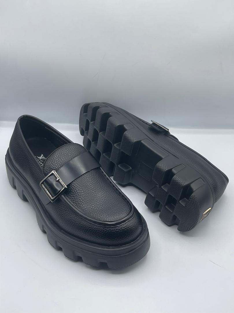 Premium Louis Vuitton chunky-sole loafers Men's dark pebbled leather Louis Vuitton loafers with a chunky royal blue rubber sole and silver buckle strap.