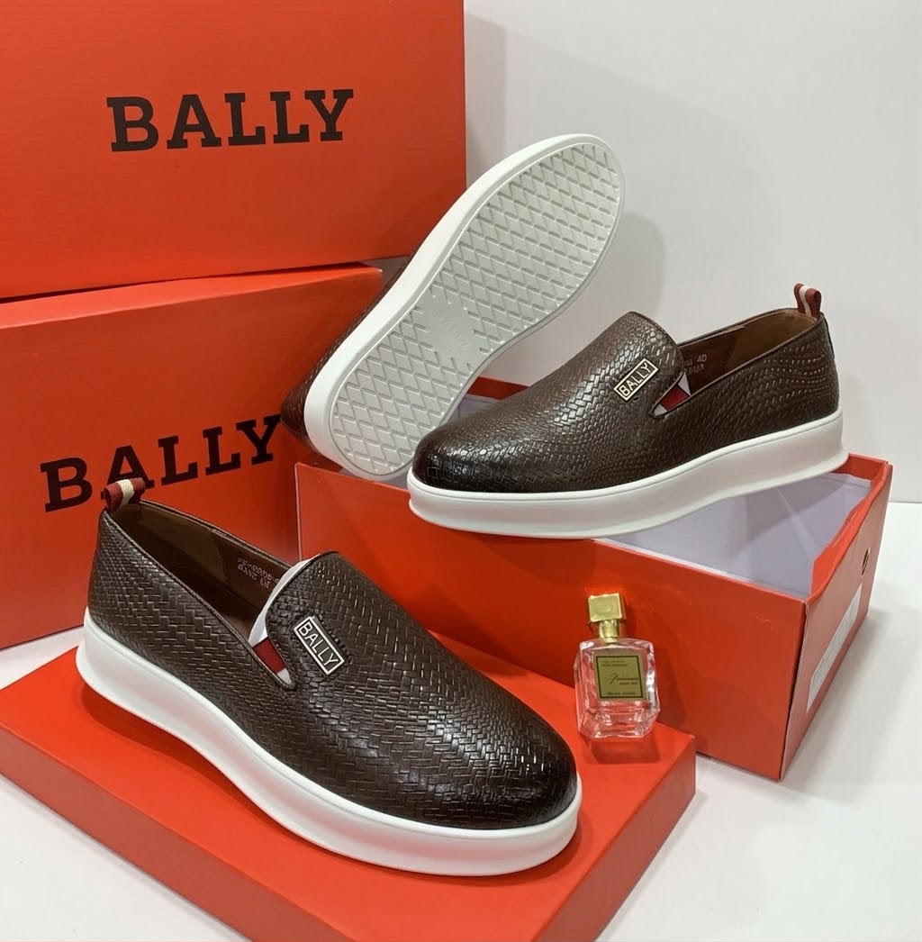 Bally woven leather slip-ons Dark brown men's woven leather Bally slip-on shoes with white rubber sole and metallic logo plaque.